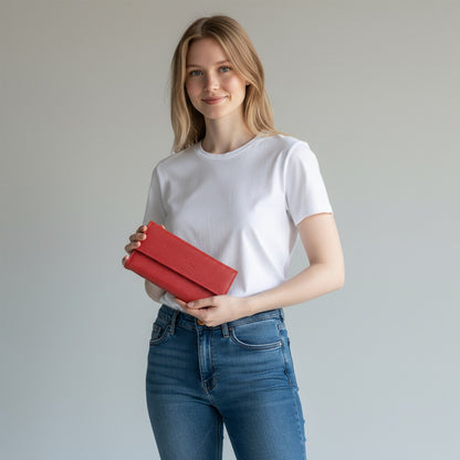 Woman holding a Regalos Ejecutivos Ortiz red genuine leather elongated wallet with a snap closure